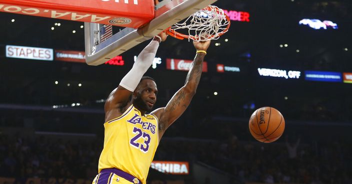 Los Angeles Lakers' LeBron James dunks during the first half of the team's NBA basketball game against the Oklahoma City Thunder on Tuesday, Nov. 19, 2019, in Los Angeles. (AP Photo/Ringo H.W. Chiu)