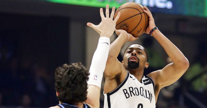 Brooklyn Nets' Spencer Dinwiddie (8) shoots over Cleveland Cavaliers' Cedi Osman (16) in the first half of an NBA basketball game, Monday, Nov. 25, 2019, in Cleveland. The Nets won 108-106. (AP Photo/Tony Dejak)