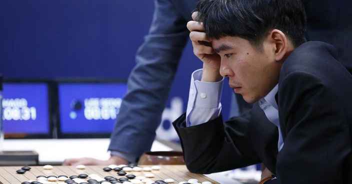 South Korean professional Go player Lee Sedol reviews the match after finishing the third match of the Google DeepMind Challenge Match against Google's artificial intelligence program, AlphaGo, in Seoul, South Korea, Saturday, March 12, 2016. Google's Go-playing software defeated a human champion for the third straight time Saturday to clinch the best-of-five series and establish its superiority in an ancient Chinese game long thought to be the realm of humans. (AP Photo/Lee Jin-man)