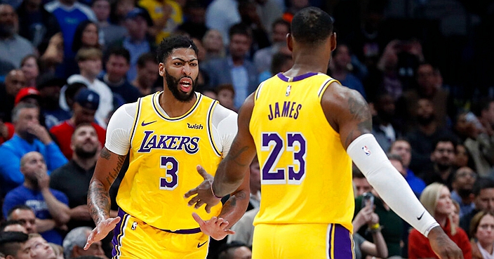 Los Angeles Lakers' Anthony Davis (3) and LeBron James celebrate after a basket by Davis during the second half of the team's NBA basketball game against the Dallas Mavericks in Dallas, Friday, Nov. 1, 2019. (AP Photo/Tony Gutierrez)