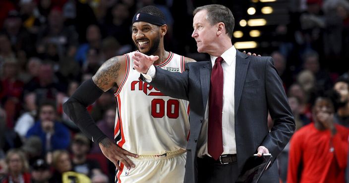 Portland Trail Blazers forward Carmelo Anthony, left, speaks with head coach Terry Stotts during the second half of an NBA basketball game against the Chicago Bulls in Portland, Ore., Friday, Nov. 29, 2019. The Blazers won 107-103. (AP Photo/Steve Dykes)