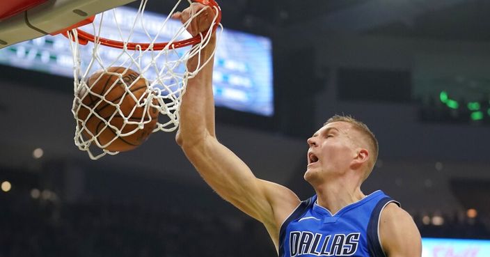 Dallas Mavericks' Kristaps Porzingis dunks during the first half of an NBA basketball game against the Milwaukee Bucks Monday, Dec. 16, 2019, in Milwaukee. (AP Photo/Morry Gash)