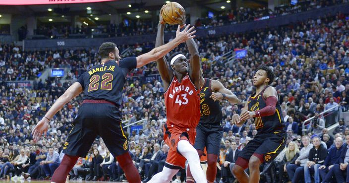 Toronto Raptors forward Pascal Siakam (43) drives to the net past Cleveland Cavaliers forward Larry Nance Jr. (22) centre Tristan Thompson (13) and guard Darius Garland (10) during second half NBA basketball action in Toronto on Monday, Dec. 16, 2019. (Nathan Denette/The Canadian Press via AP)