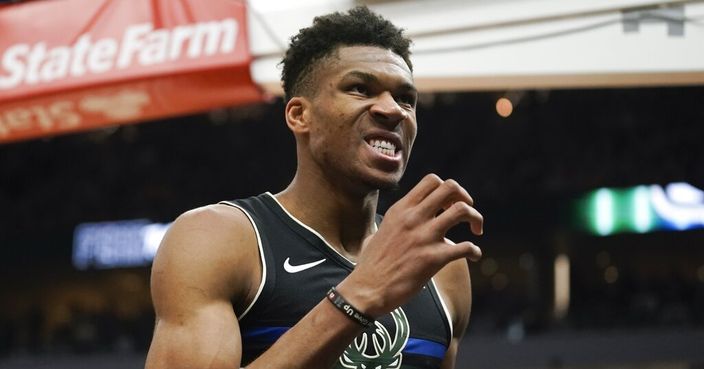 Milwaukee Bucks' Giannis Antetokounmpo reacts after making a basket and being fouled during the second half of an NBA basketball game against the Los Angeles Lakers Thursday, Dec. 19, 2019, in Milwaukee. The Bucks won 111-104. (AP Photo/Morry Gash)
