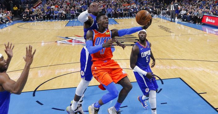 Oklahoma City Thunder guard Dennis Schroder (17) goes to the basket against the Los Angeles Clippers during the second half of an NBA basketball game Sunday, Dec. 22, 2019, in Oklahoma City. Oklahoma City won 118-112. (AP Photo/Alonzo Adams)