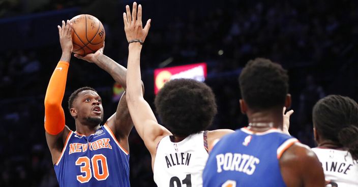 Brooklyn Nets center Jarrett Allen (31) defends against New York Knicks forward Julius Randle (30) who shoots during the first half of an NBA basketball game, Thursday, Dec. 26, 2019, in New York. (AP Photo/Kathy Willens)