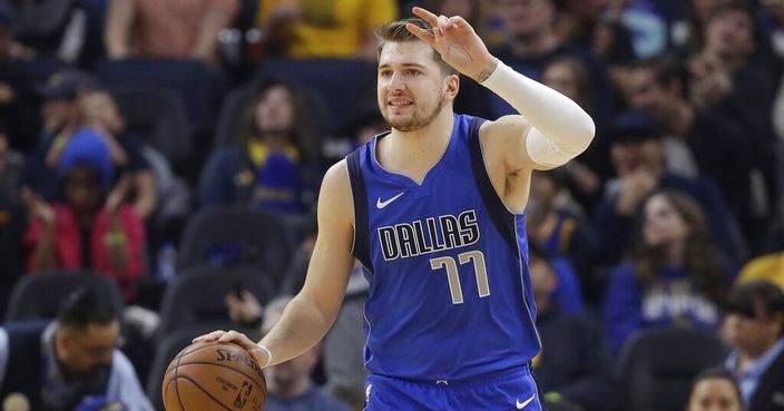 Dallas Mavericks forward Luka Doncic (77) dribbles upcourt against the Golden State Warriors during the first half of an NBA basketball game in San Francisco, Saturday, Dec. 28, 2019. (AP Photo/Jeff Chiu)