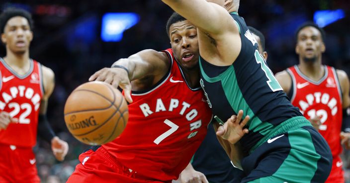 Boston Celtics' Grant Williams (12) defends against Toronto Raptors' Kyle Lowry (7) during the second half on an NBA basketball game in Boston, Saturday, Dec. 28, 2019. (AP Photo/Michael Dwyer)