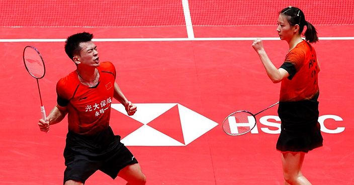 China's Zheng Si Wei, left, and his teammate Huang Ya Qiong celebrates after defeating Japan's Yuta Watanabe and Arisa Higashino in their mixed doubles badminton semifinal match at the World Tour Finals in Guangzhou in south China's Guangdong province, Saturday, Dec. 14, 2019. (AP Photo/Andy Wong)