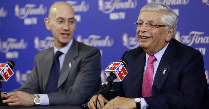 FILE - In this Thursday, June 6, 2013 file photo, David Stern, NBA Commissioner, right, and Adam Silver, Deputy Commissioner, speak before the start of Game 1 of the NBA Finals basketball game between the San Antonio Spurs and Miami Heat in Miami. David Stern, who spent 30 years as the NBA's longest-serving commissioner and oversaw its growth into a global power, has died on New Year’s Day, Wednesday, Jan. 1, 2020. He was 77. (AP Photo/Wilfredo Lee, File)