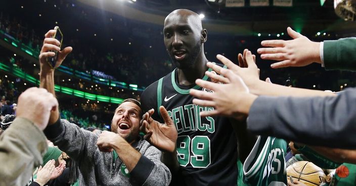 Boston Celtics' Tacko Fall (99) comes off the court following an NBA basketball game against the Charlotte Hornets in Boston, Sunday, Dec. 22, 2019. (AP Photo/Michael Dwyer)