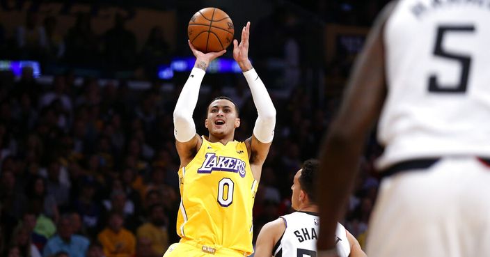 Los Angeles Lakers' Kyle Kuzma (0) shoots against the Los Angeles Clippers during the first half of an NBA basketball game Wednesday, Dec. 25, 2019, in Los Angeles. (AP Photo/Ringo H.W. Chiu)