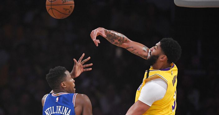 Los Angeles Lakers forward Anthony Davis, right, rejects a shot by New York Knicks guard Frank Ntilikina during the first half of an NBA basketball game Tuesday, Jan. 7, 2020, in Los Angeles. (AP Photo/Mark J. Terrill)