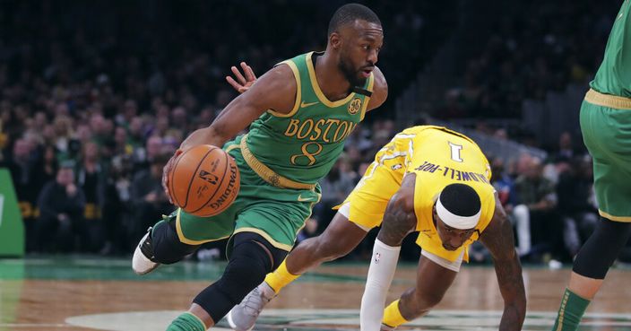 Boston Celtics guard Kemba Walker (8) drives to the basket past Los Angeles Lakers guard Kentavious Caldwell-Pope (1) during the first half of an NBA basketball game in Boston, Monday, Jan. 20, 2020. (AP Photo/Charles Krupa)