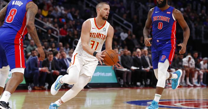 FILE - In this Nov. 22, 2019, file photo, Atlanta Hawks forward Chandler Parsons (31) passes the ball during the second half of an NBA basketball game against the Detroit Pistons in Detroit. Parsons' attorneys say the Hawks forward suffered “severe and permanent injuries