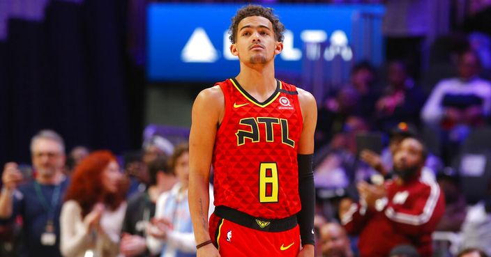 Atlanta Hawks guard Trae Young (11) wears a No. 8 jersey honoring former NBA player Kobe Bryant prior to an NBA basketball game against the Washington Wizards, Sunday, Jan. 26, 2020, in Atlanta. Bryant died in a California helicopter crash Sunday. (AP Photo/Todd Kirkland)