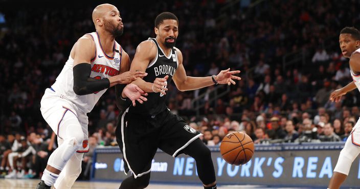 Brooklyn Nets guard Spencer Dinwiddie (8) loses the ball as New York Knicks guard Elfrid Payton (6) collides with him during the second half of an NBA basketball game in New York, Sunday, Jan. 26, 2020. The Knicks defeated the Nets 110-97. (AP Photo/Kathy Willens)