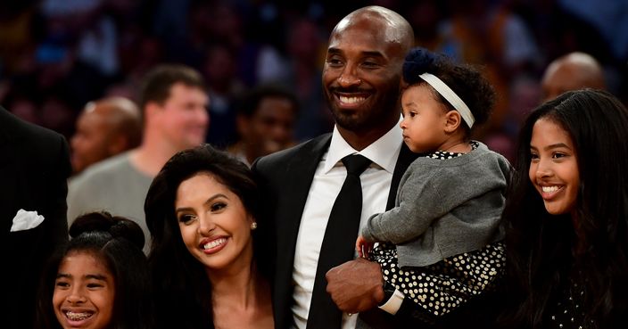 LOS ANGELES, CA - DECEMBER 18:  Kobe Bryant poses with his family at halftime after both his #8 and #24 Los Angeles Lakers jerseys are retired at Staples Center on December 18, 2017 in Los Angeles, California. NOTE TO USER: User expressly acknowledges and agrees that, by downloading and or using this photograph, User is consenting to the terms and conditions of the Getty Images License Agreement.  (Photo by Harry How/Getty Images)