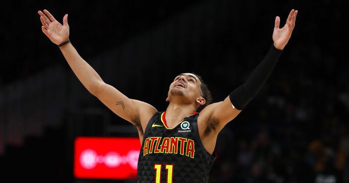 Atlanta Hawks guard Trae Young (11) reacts after hitting a basket during the second half of an NBA basketball game against the Philadelphia 76ers, Thursday, Jan. 30, 2020, in Atlanta. (AP Photo/John Bazemore)