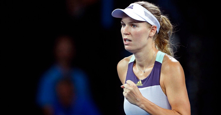 Denmark's Caroline Wozniacki reacts after defeating United States' Kristie Ahn in their first round singles match at the Australian Open tennis championship in Melbourne, Australia, Monday, Jan. 20, 2020. (AP Photo/Andy Wong)