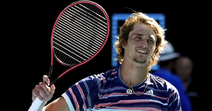 Germany's Alexander Zverev waves after defeating Switzerland's Stan Wawrinka in quarterfinal match at the Australian Open tennis championship in Melbourne, Australia, Wednesday, Jan. 29, 2020. (AP Photo/Lee Jin-man)