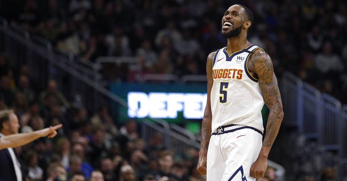 Denver Nuggets' Will Barton reacts after making a shot during the second half of the team's NBA basketball game against the Milwaukee Bucks on Friday, Jan. 31, 2020, in Milwaukee. (AP Photo/Aaron Gash)