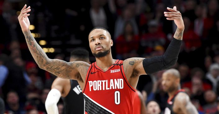 Portland Trail Blazers guard Damian Lillard urges on the crowd after scoring during the second half of the team's NBA basketball game against the Houston Rockets in Portland, Ore., Wednesday, Jan. 29, 2020. The Blazers won 125-112. (AP Photo/Steve Dykes)
