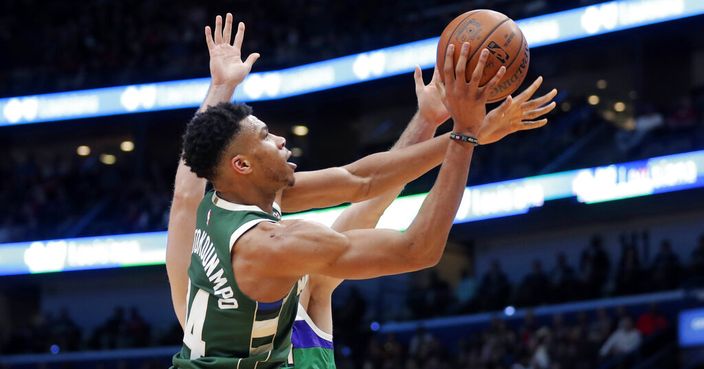 Milwaukee Bucks forward Giannis Antetokounmpo shoots in the second half of an NBA basketball game against the New Orleans Pelicans in New Orleans, Tuesday, Feb. 4, 2020. The Bucks won 120-108. (AP Photo/Gerald Herbert)