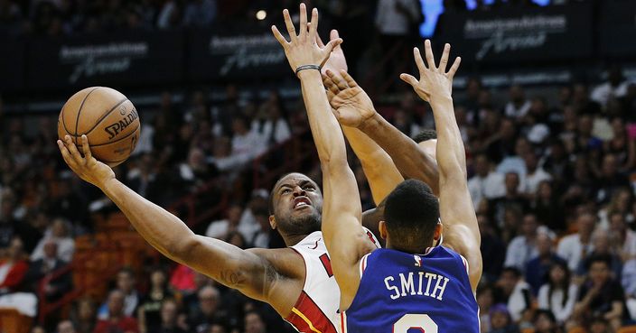 MIAMI, FLORIDA - APRIL 09: Dion Waiters #11 of the Miami Heat attempts a layup against Zhaire Smith #8 of the Philadelphia 76ers during the first half at American Airlines Arena on April 09, 2019 in Miami, Florida. NOTE TO USER: User expressly acknowledges and agrees that, by downloading and or using this photograph, User is consenting to the terms and conditions of the Getty Images License Agreement.  (Photo by Michael Reaves/Getty Images)