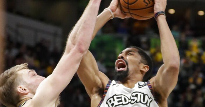 Brooklyn Nets guard Spencer Dinwiddie (26) shoots over Indiana Pacers forward Domantas Sabonis (11) during the second half of an NBA basketball game in Indianapolis, Monday, Feb. 10, 2020. (AP Photo/Michael Conroy)