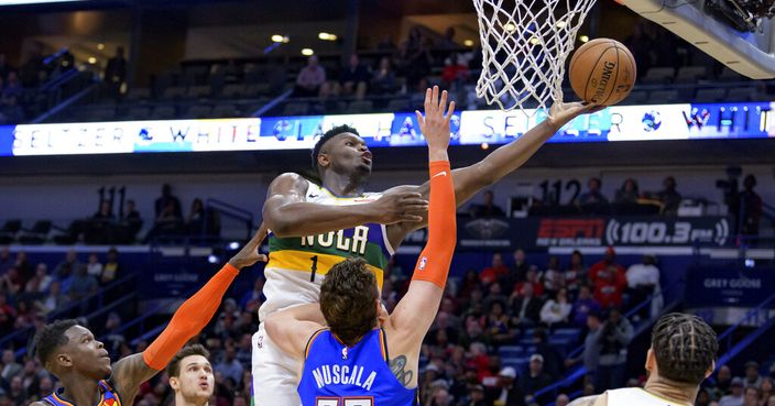 New Orleans Pelicans forward Zion Williamson (1) shoots over Oklahoma City Thunder forward Mike Muscala (33) during the second half of an NBA basketball game in New Orleans, Thursday, Feb. 13, 2020. (AP Photo/Matthew Hinton)