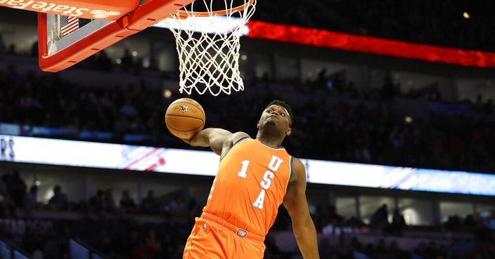 Team USA forward Zion Williamson, of the New Orleans Pelicans, goes up for a dunk against Team World during the second half of the NBA Rising Stars basketball game in Chicago, Friday, Feb. 14, 2020. (AP Photo/Nam Y. Huh)
