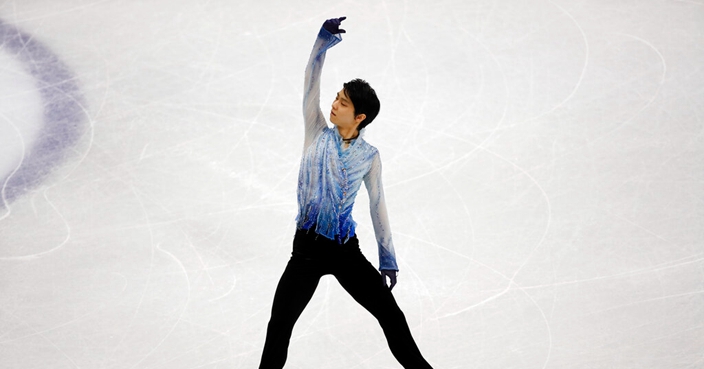 Japan's Yuzuru Hanyu competes in the men's short program during the figure skating Grand Prix finals at the Palavela ice arena, in Turin, Italy, Friday, June 7, 2019. (AP Photo/Antonio Calanni)