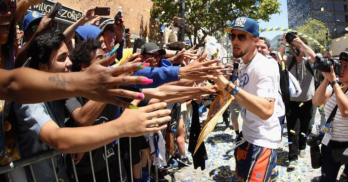 OAKLAND, CA - JUNE 12:  Stephen Curry #30 of the Golden State Warriors celebrates with the crowd during the Golden State Warriors Victory Parade on June 12, 2018 in Oakland, California.  The Golden State Warriors beat the Cleveland Cavaliers 4-0 to win the 2018 NBA Finals. NOTE TO USER: User expressly acknowledges and agrees that, by downloading and or using this photograph, User is consenting to the terms and conditions of the Getty Images License Agreement.  (Photo by Ezra Shaw/Getty Images)