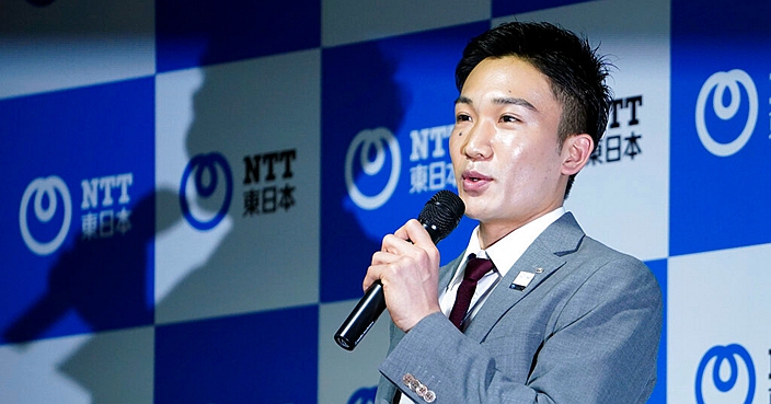 Japanese badminton player Kento Momota speaks a press conference Friday, March 6, 2020, in Tokyo. Badminton men's singles world champion and world number one Momota was injured at a traffic accident In January this year in Malaysia. (AP Photo/Eugene Hoshiko)