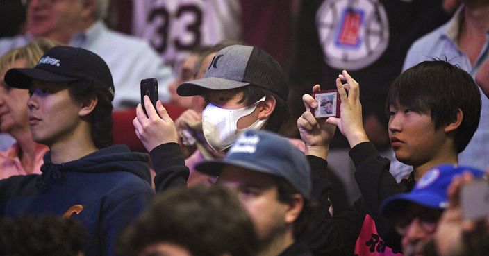 Fans watch during the first half of an NBA basketball game between the Los Angeles Clippers and the Philadelphia 76ers Sunday, March 1, 2020, in Los Angeles. (AP Photo/Mark J. Terrill)