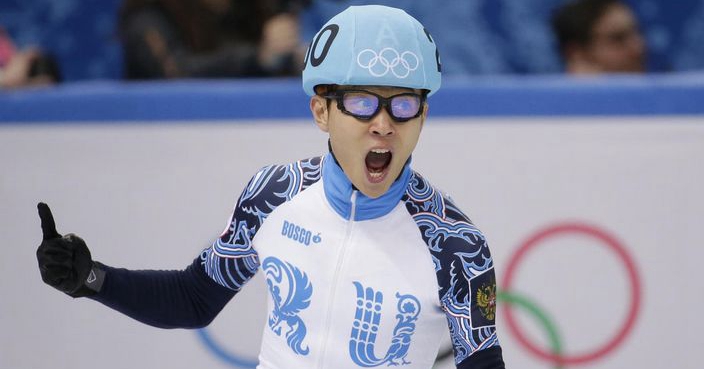 Victor An of Russia celebrates after his first place in the men's 500m short track speedskating final at the Iceberg Skating Palace during the 2014 Winter Olympics, Friday, Feb. 21, 2014, in Sochi, Russia. (AP Photo/Bernat Armangue)