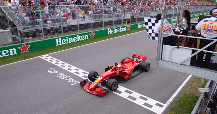 Ferrari's Sebastian Vettel of Germany crosses the finish line to win the Canadian Grand Prix Sunday, June 10, 2018 in Montreal. (Paul Chiasson/The Canadian Press via AP)