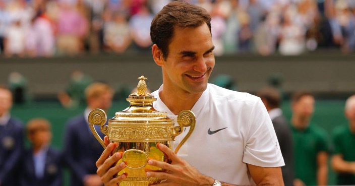 Switzerland’s Roger Federer holds the trophy after defeating Croatia’s Marin Cilic to win the Men's Singles final match on day thirteen at the Wimbledon Tennis Championships in London Sunday, July 16, 2017. (AP Photo/Alastair Grant)