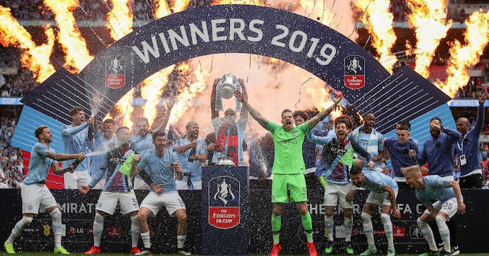 LONDON, ENGLAND - MAY 18: Vincent Kompany of Manchester City lifts the trophy following the FA Cup Final match between Manchester City and Watford at Wembley Stadium on May 18, 2019 in London, England. (Photo by Richard Heathcote/Getty Images)